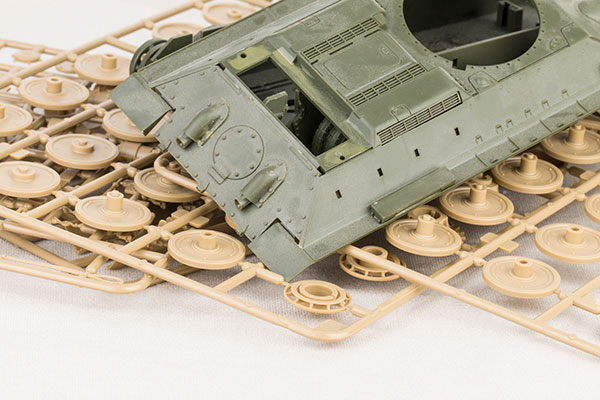 Plastic injection molded model of a military tank