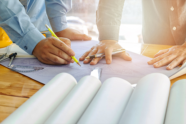 Two people working on a product diagram